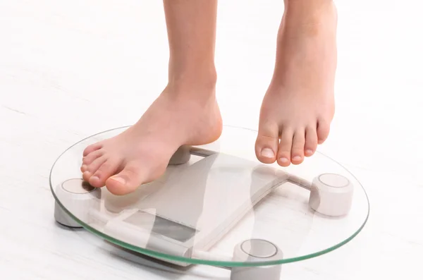 Standing on scales — Stock Photo, Image