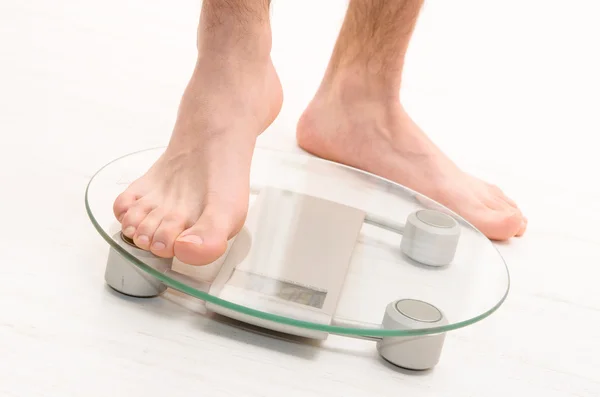 Standing on scales — Stock Photo, Image