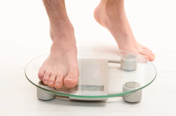 Standing on scales — Stock Photo, Image