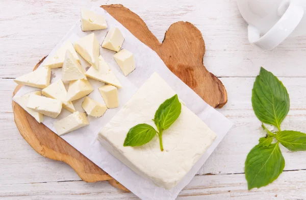 Feta cheese on wooden board. — Stock Photo, Image