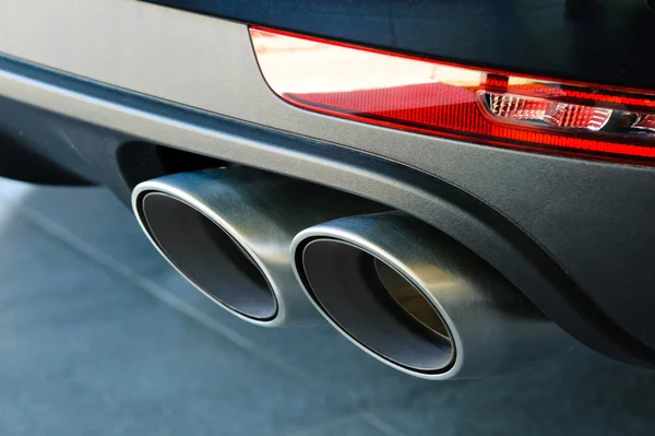 Close up of a car dual exhaust pipe Royalty Free Stock Photos