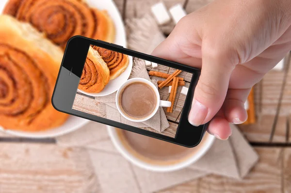 Hands taking photo cocoa with smartphone — Stock Photo, Image