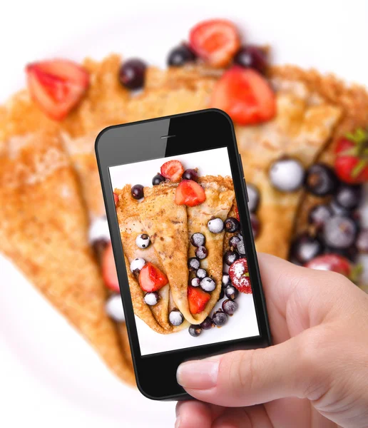 Hands taking photo pancakes with smartphone — Stock Photo, Image