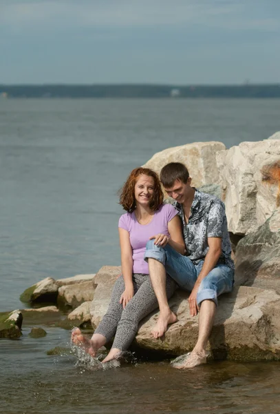 Man and woman on the beach — Stock Photo, Image