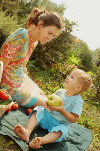 Woman with little son at picnic — Stock Photo, Image