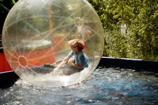 Boy inside a transparent sphere — Stock Photo, Image
