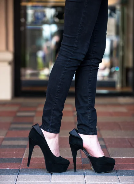 High heels on paver blocks — Stock Photo, Image