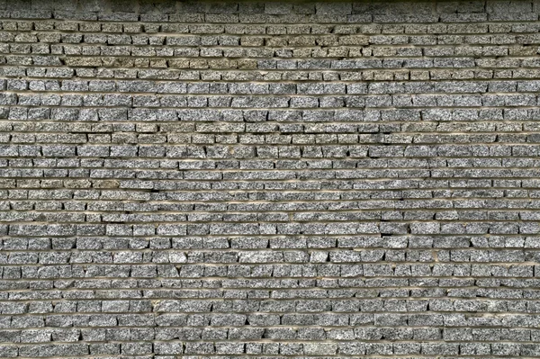 Wall from a granite brick — Stock Photo, Image