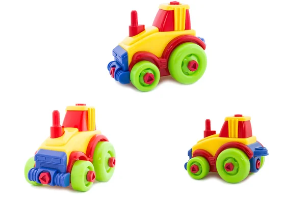 Set. Toy a plastic nursery, a tractor of bright shades. — Stock Photo, Image