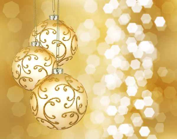 Drie prachtige gouden kerstballen — Stockfoto