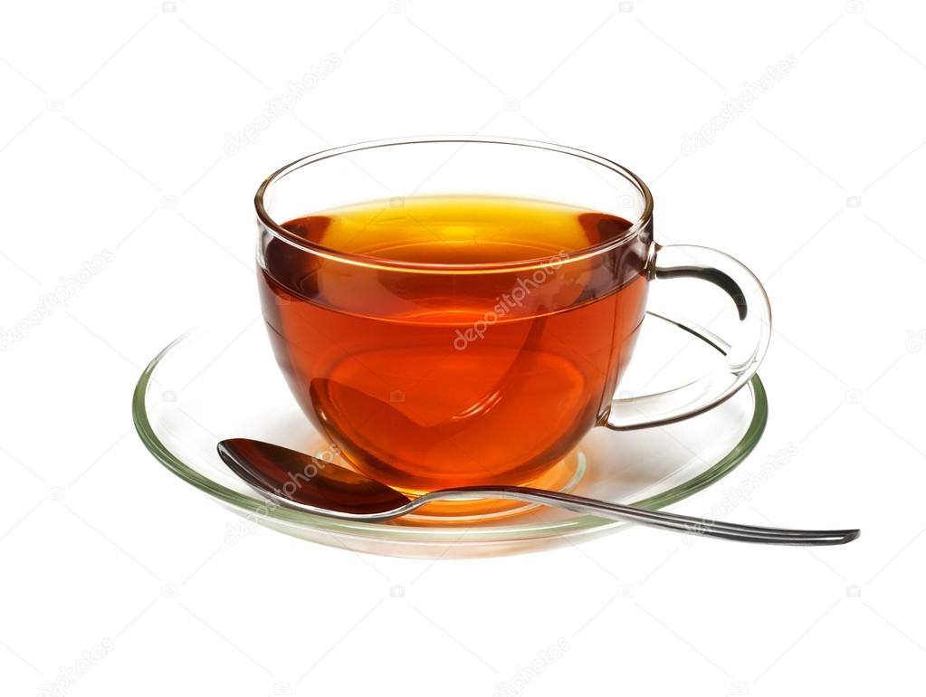 Glass cup with black tea and spoon
