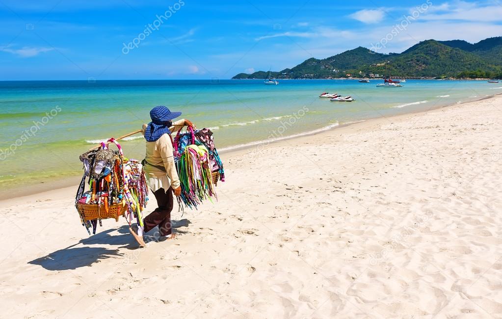 Thai woman selling beachwear at beach in Koh Samui, Thailand.