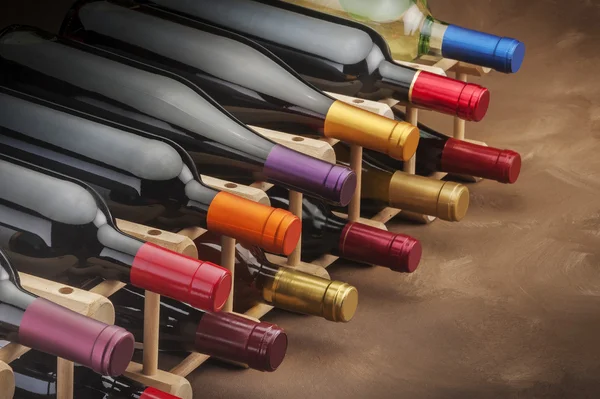 Wine bottles in rack — Stock Photo, Image