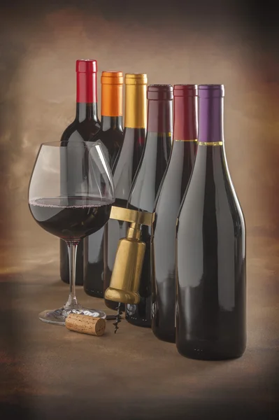 Wine bottles, glass and corkscrew — Stock Photo, Image