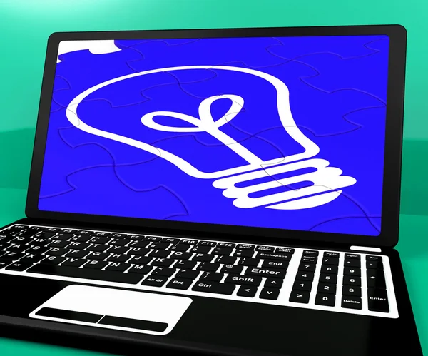 Bulb Puzzle On Notebook Showing Computer Energy — Stock Photo, Image