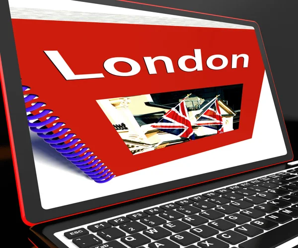 Londyn książki na laptopa pokazuje Przewodnik Wielkiej Brytanii — Zdjęcie stockowe