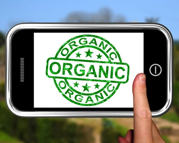 Органические на смартфоне демонстрируют экологические продукты — стоковое фото
