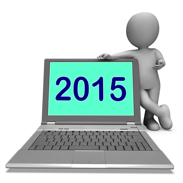 Två tusen och femton karaktär och laptop visar år 2015 — Stockfoto