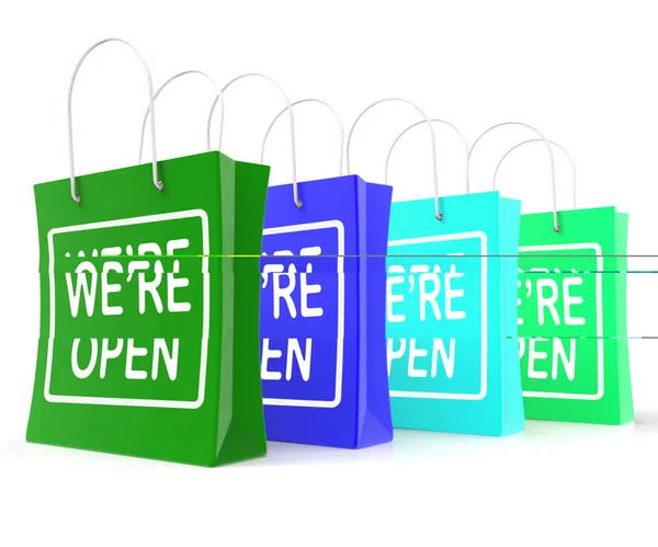 Vi er åpne shoppingsekker viser ny butikk lansering – stockfoto