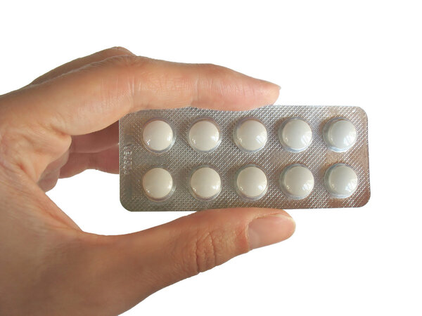 Blister of piles in the hand isolated on white