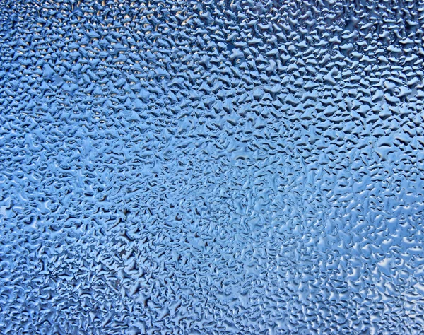 Blue water drops on a glass — Stock Photo, Image