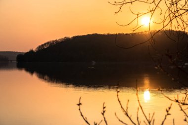 Calm lake landscape with beautiful sunset sky