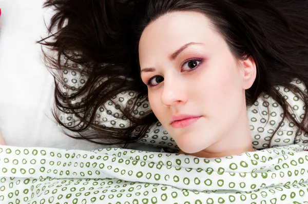 Young woman in the bed — Stock Photo, Image