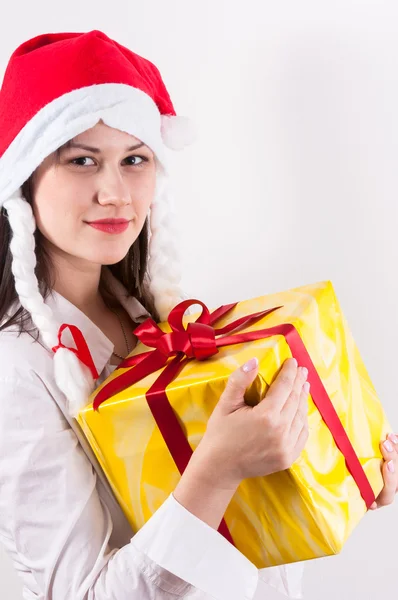Young woman with christmas present — Stock Photo, Image
