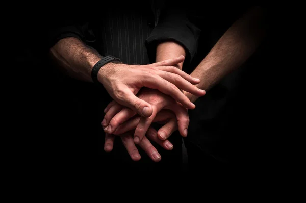 Group of young adults making a pile of hands — Stock Photo, Image