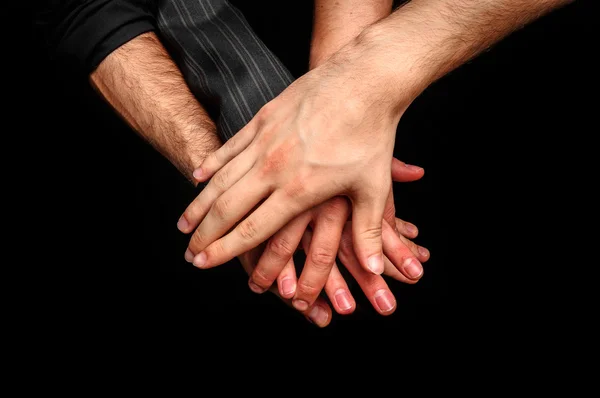 Groep van jonge volwassenen een stapel van handen maken — Stockfoto