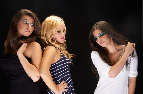 A group of young models against dark background — Stock Photo, Image