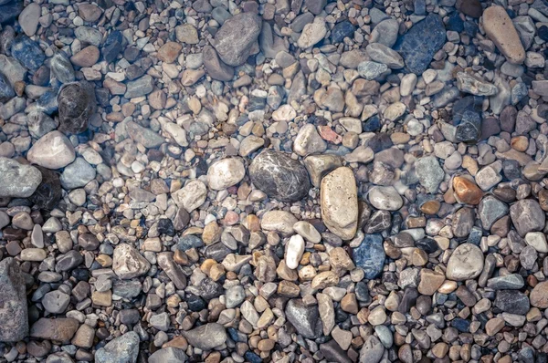 Pebble stone closeup on the shore — Stock Photo, Image