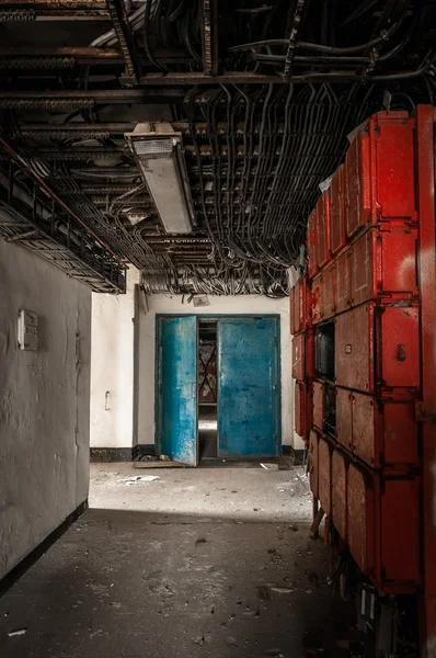 Corridor with a lot of junction boxes and cables — Stock Photo, Image