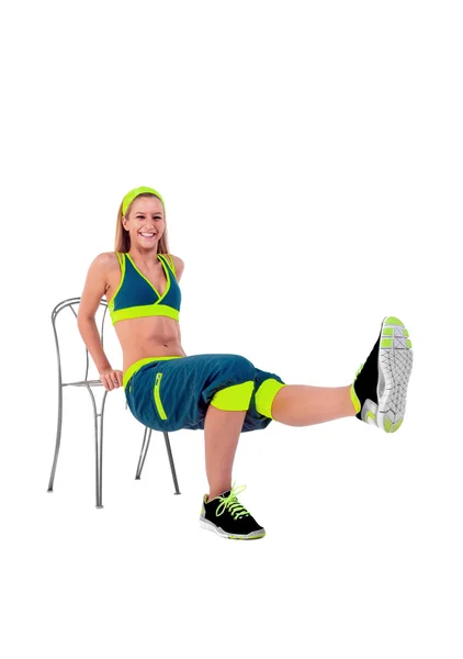 Young fitness instructor sitting on chair — Stock Photo, Image