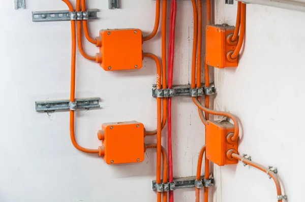 Orange electric boxes — Stock Photo, Image