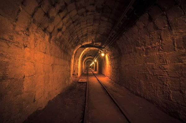 Underground mine passage with rails — Stock Photo, Image