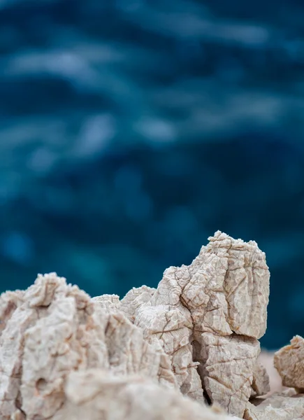 Sharp stones at the shores — Stock Photo, Image