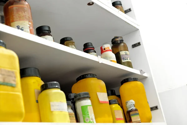 Photo of an old laboratory with a lot of bottles — Stock Photo, Image