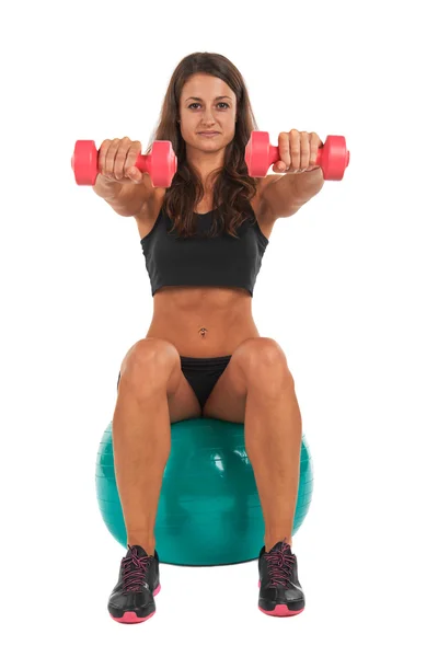 Young woman in the studio with weights — Stock Photo, Image