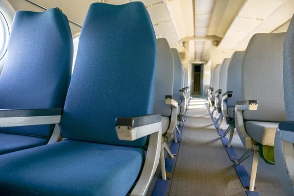 Interior of an airplane with many seats — Stock Photo, Image