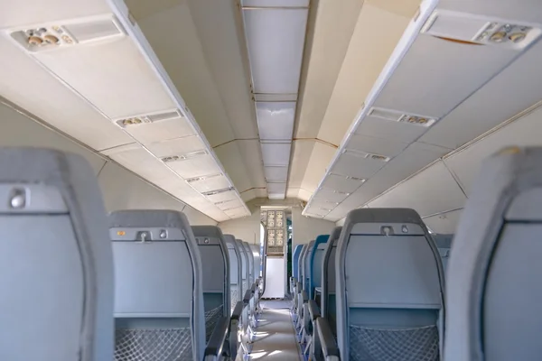 Interior of an airplane with many seats — Stock Photo, Image