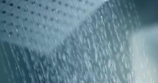 Water pouring from shower letting off steam — Stock Video