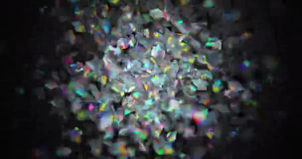 Små färgglada partiklar skakar mot mörk bakgrund — Stockvideo