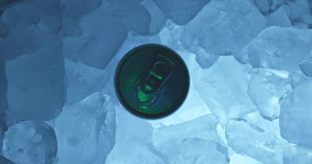 Tin can in ice rotating top view closeup footage with colorful lights — Stock Video