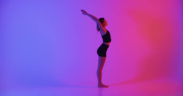 Blonde woman doing yoga exercise in studio closeup — Stock Video