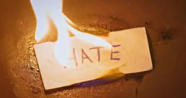 Closeup Video Burning Paper Hate Written — Stock Video