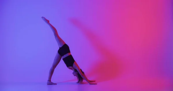 Blonde Woman Doing Yoga Studio Colorful Background Closeup — Foto Stock