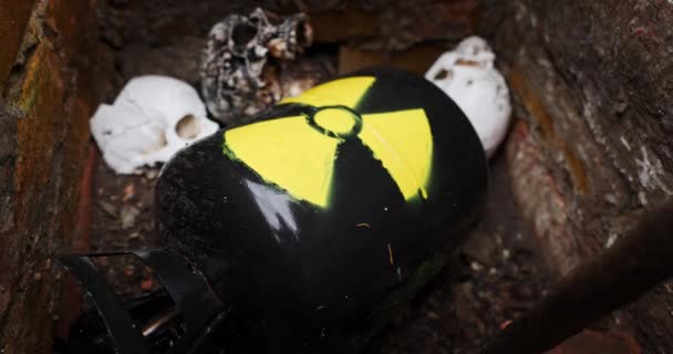 Nuclear waste between skulls closeup — Stock Video