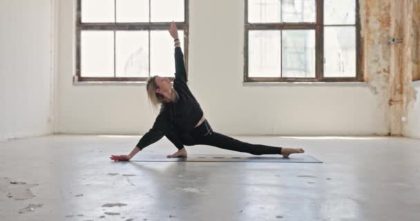 Dynamic Camera Movement Woman Doing Yoga Industrial Interior Closeup — ストック動画