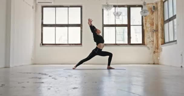 Dynamic Camera Movement Woman Doing Yoga Industrial Interior Closeup — ストック動画